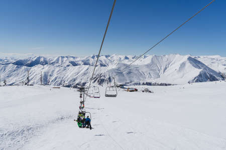 Gudauri, Georgia - February 16, 2016: People climb the ski lift of Gudauri, Georgia.のeditorial素材