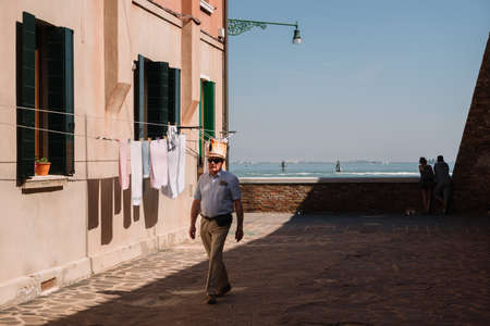 Venice, Italy - August 14, 2016: People are walking on the street of Cannaregio district in Venice, Italy.のeditorial素材