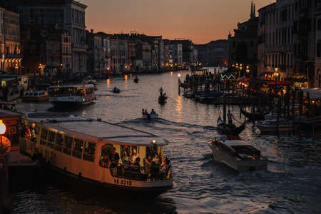 Venice, Italy - August 13, 2016: Gondoliers at dusk on the Grand Canal of Venice, Italy.のeditorial素材