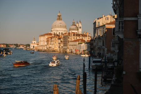 Venice, Italy - August 13, 2016: Boats are driving on the Grand Canal at sunset in Venice, Italy.のeditorial素材
