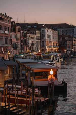 Venice, Italy - August 13, 2016: The buildings on the Grand Canal of Venice, Italy,  embankment lit lights. It got dark.のeditorial素材