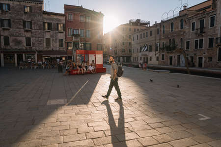 Venice, Italy - August 13, 2016: Tourists are resting by the canal of Venice, Italy.のeditorial素材