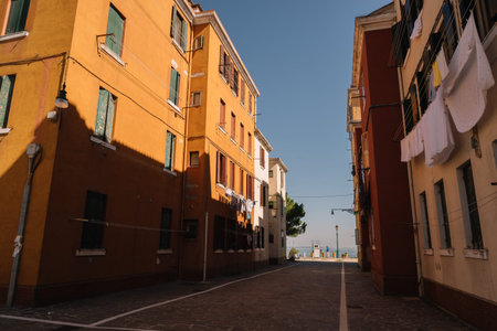 Venice, Italy - August 14, 2016: The Calle Case Nuove Street leading to the promenade and gas...