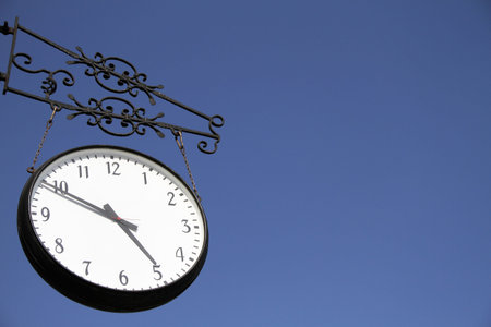 wall clock and blue sky