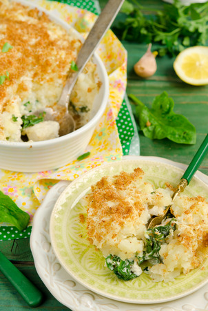 Fish pie baked with dorado, topped with mashed potato, breadcrumbs and cheeseの写真素材