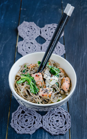 Chinese soba noodles with fish and spinach