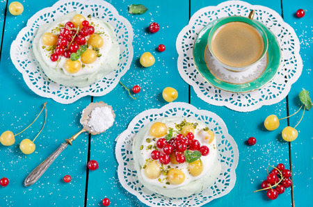 Cake  Pavlova  with tea Match, and fresh berriesの写真素材