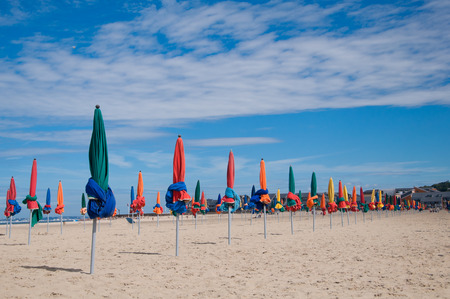 Beach umbrellas on a beach in Deauville, Normandyの写真素材