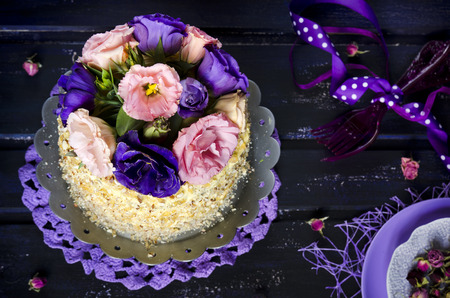 Cake with almonds and poppy seeds on a dark wood backgroundの写真素材