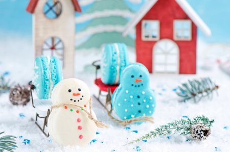 Christmas makarons with chocolate ganache on white backgroundの写真素材