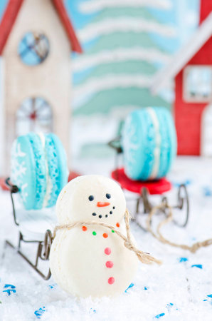 Christmas makarons with chocolate ganache on white backgroundの写真素材