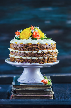 Carrot cake with cream cheese frosting and mangoの写真素材
