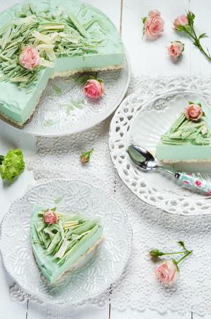 Coconut cheesecake with matcha tea and white chocolateの写真素材