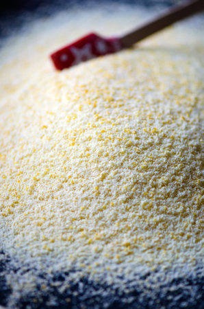 Heap of Chick Pea flour on an old wooden table