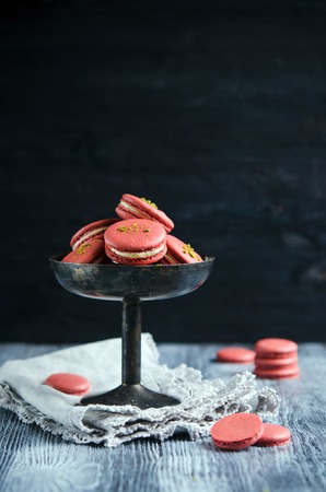 Makarons of chickpeas with pistachio cream on wooden backgroundの写真素材