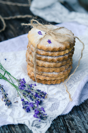 Shortbread Sable with lavender on a wooden backgroundの写真素材