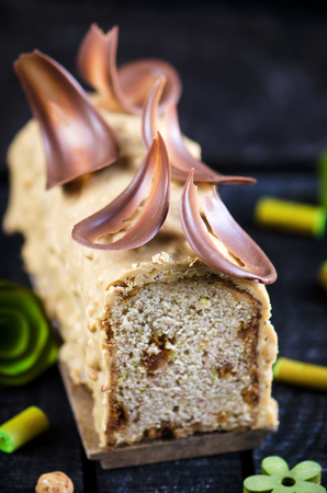 Banana cake with hazelnuts under chocolate glazeの写真素材