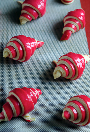 Raspberry croissant on a dark wooden backgroundの写真素材