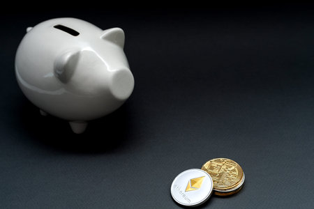 Ethereum and Bitcoin, defocused piggy bank, moneybox Virtual cryptocurrency