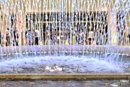 Wall of jets of a large fountain in a shopping center.の写真素材