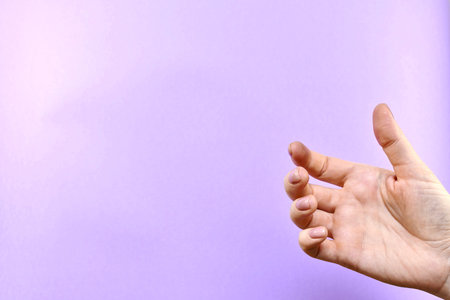 Hand, empty, without anything as if holding, a mobile phone or something flat.