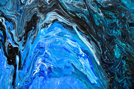 A pattern of spilled paint resembling a wave of blue with shades and inclusions of green, turquoise,...