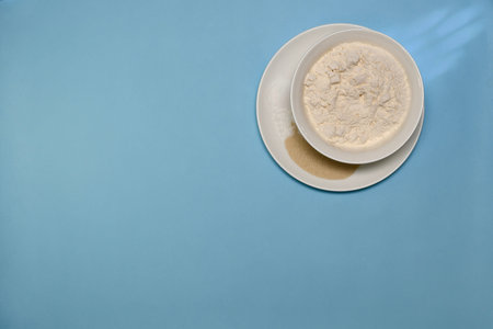 Some of the ingredients for the dough, cooked in ceramic white plates, are made one on top of each...