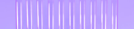 Glass tubes exhibited vertically on a purple background.