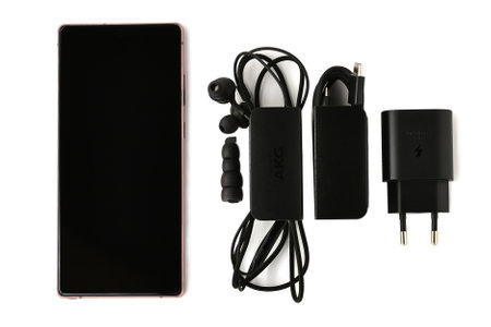 Surgut, Khanty-Mansiyskiy avtonomnyy okrug, Russia - December 27, 2020: Samsung Galaxy Note 20 smartphone bronze. Complete set a wired headset silicone headphones a USB cable with a power supply.のeditorial素材