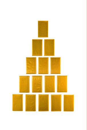 Gold bars laid with a pyramid. Isolated on a white background.の写真素材