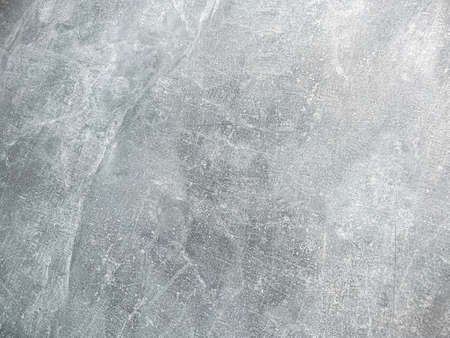 Cement plaster background is gray with lots of scratches and features.の写真素材