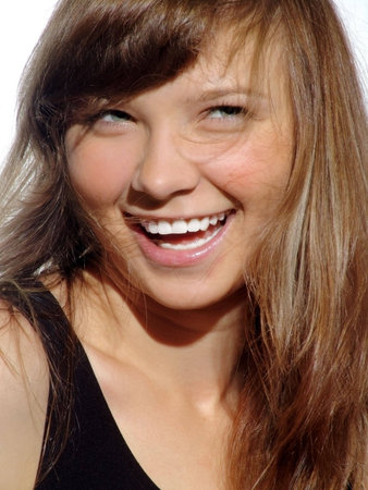 Young beautiful laughing girl with green eyes