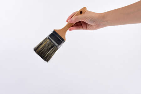 Hand and Clean new paint brush isolated on white background.の写真素材