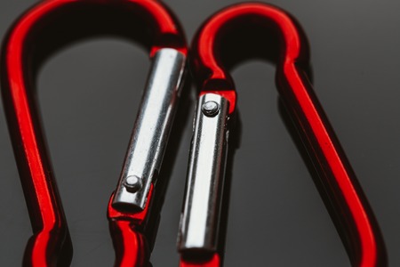 several metal carabiner red on a dark background.の写真素材