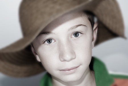 smiling caucasian child with hatの写真素材