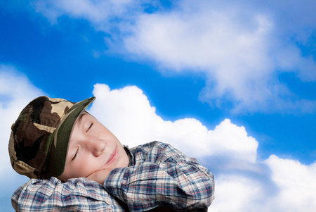 child that dream aon blue sky backgroundの写真素材