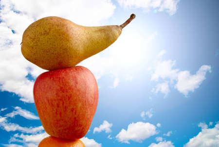 Fruit on the sky and sun raysの写真素材