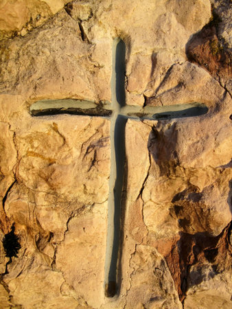 tombstone cross carved on the stoneの写真素材