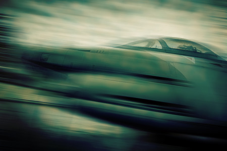 fly fighter - blurred style photoの写真素材