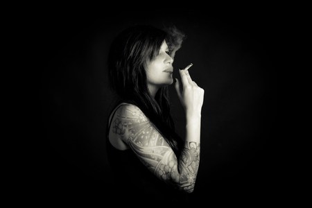 woman cigarette smoking - black and white portraitの写真素材