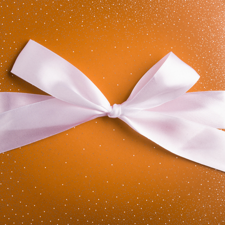 yellow mustard gift box with white ribbonの写真素材