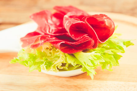 italian bresaola prosciutto -typical food made of cow meat of the Valtellina Lombardia Italyの写真素材