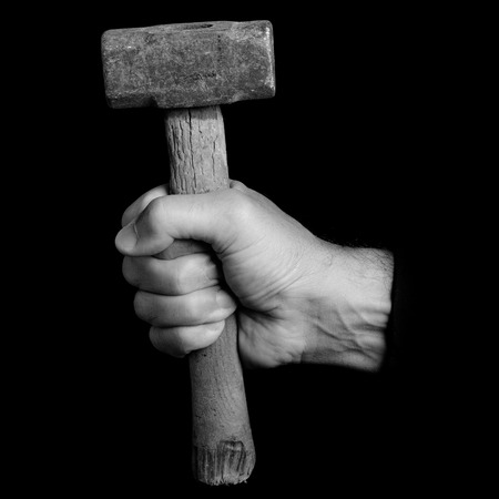 mallet - tools in a man's hand - black and white photoの写真素材