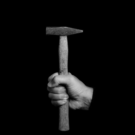 hammer- tools in a man's hand - black and white photoの写真素材