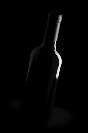 wine bottle on black background - black and white photoの写真素材