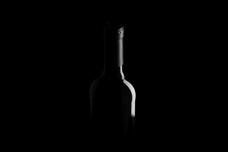 wine bottle on black background - black and white photoの写真素材