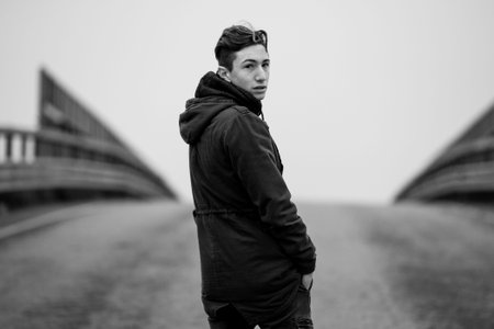 young boy on the road - black and white photo
