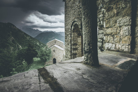 church in  mountain landscape - spring mood - desaturated style image