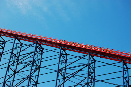 Tall rollercoaster with people on