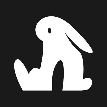 Sitting cartoon bunny. White symbol on black backdrop. Design elementのイラスト素材